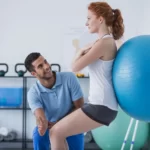 Physiotherapist is giving therapy to a girl